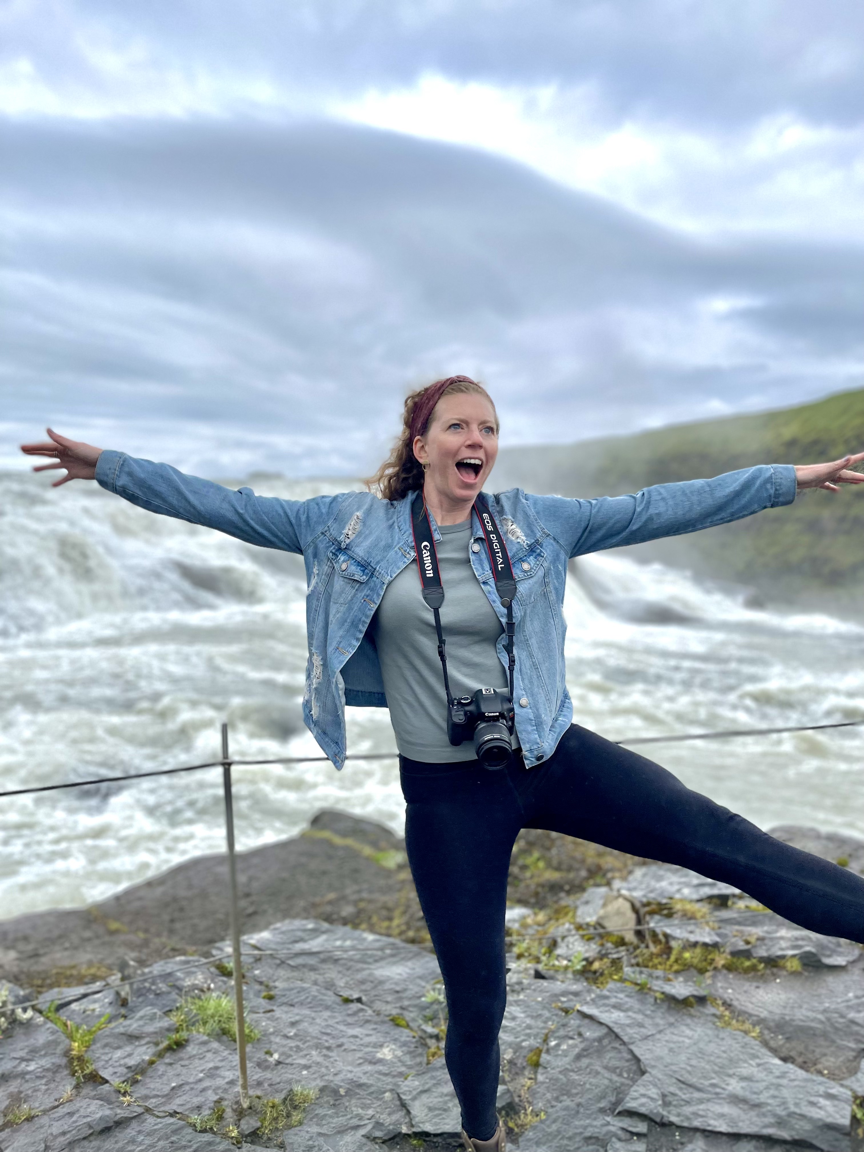 photo of Morgan in front of a waterfall making a silly pose